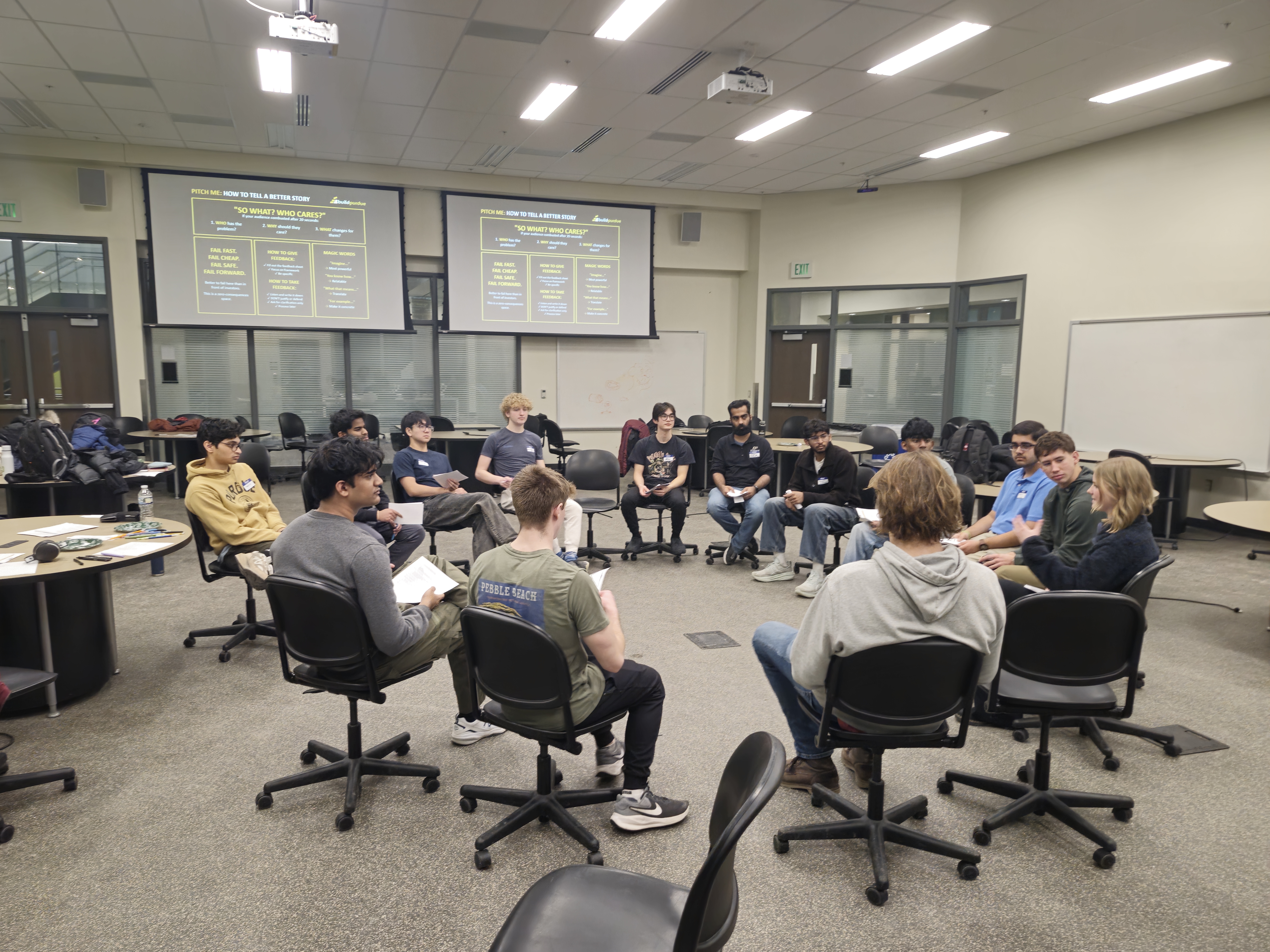 buildpurdue Cohort members talking together in a circle