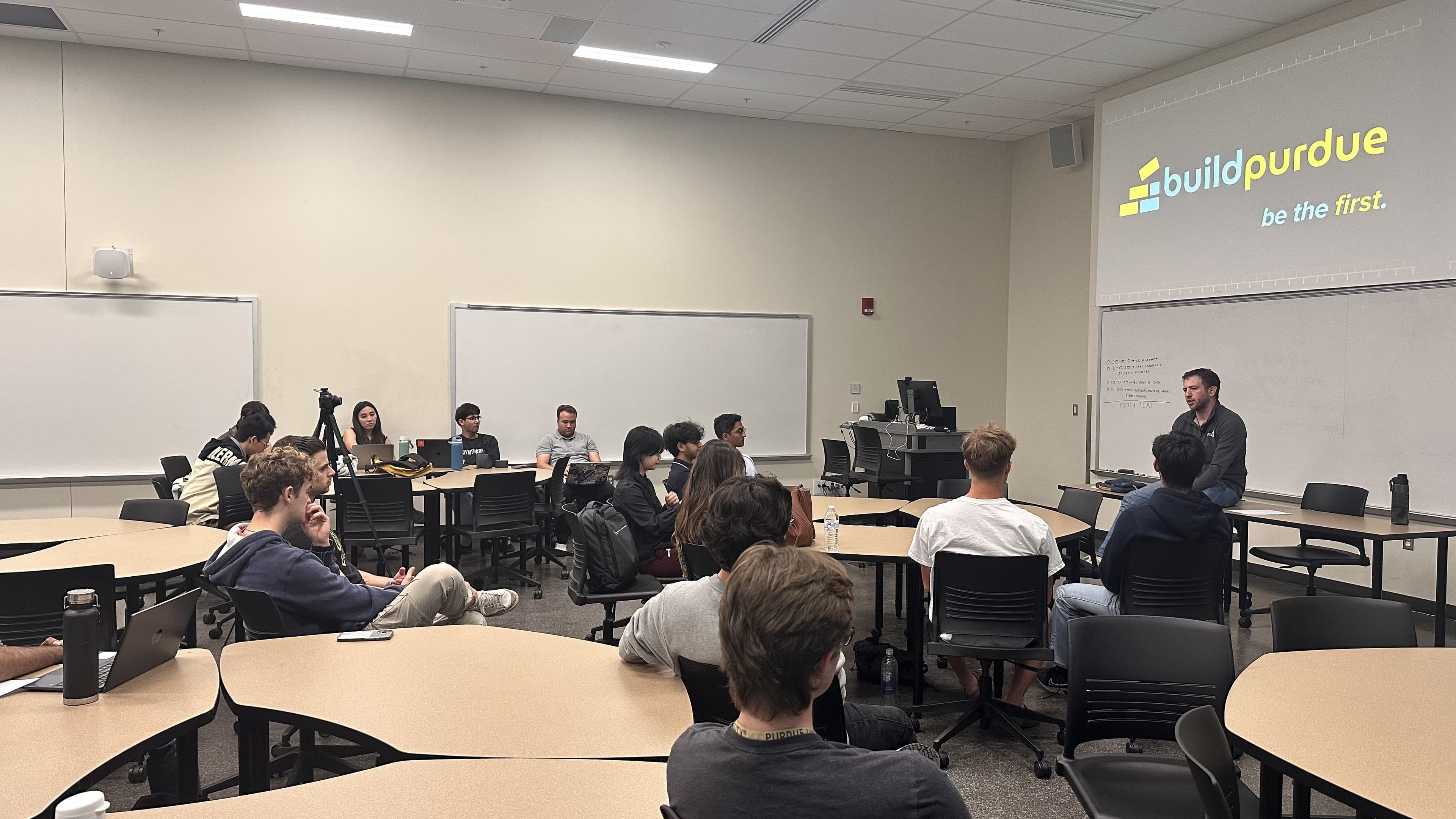 A founder answering questions in front of buildpurdue students