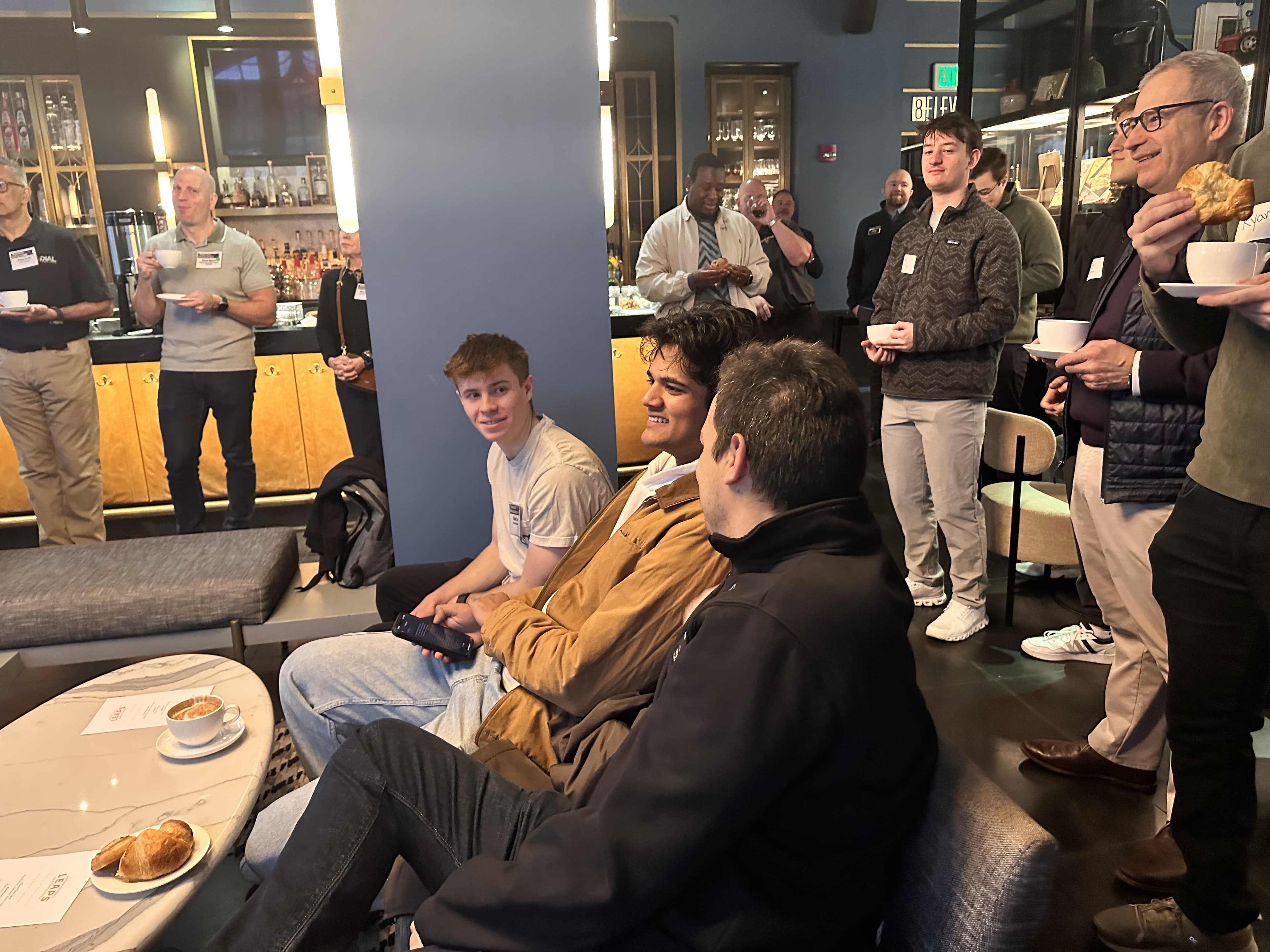 buildpurdue students and guests talking together at a community social